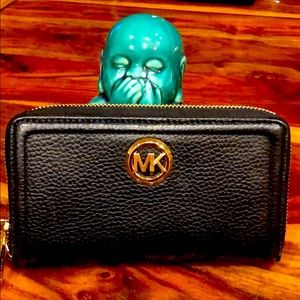 Michael Kor zippered black wallet with gold trim